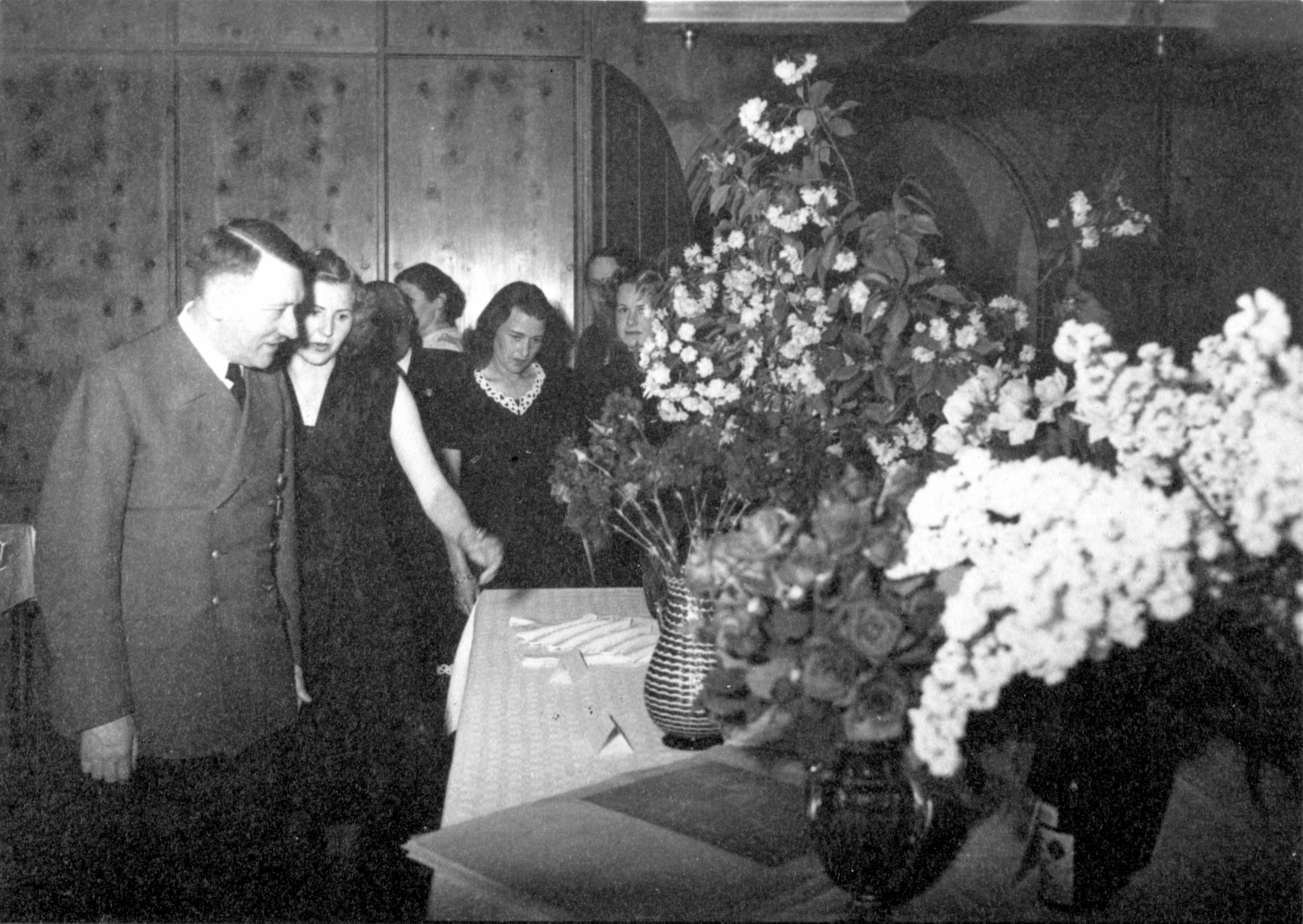 Adolf Hitler and Eva Braun look at the gifts on the occasion of the 54th birthday of the Führer, from Eva Braun's albums
